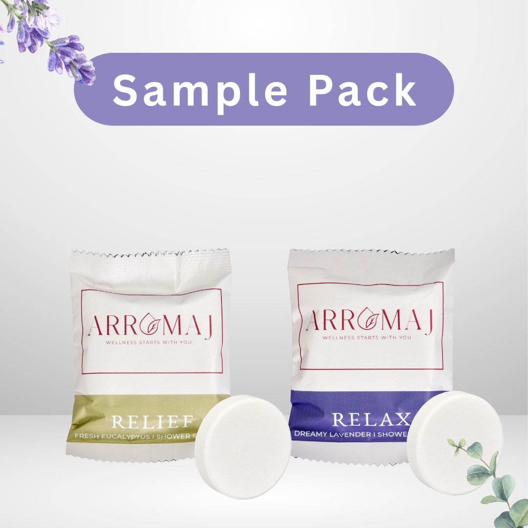 Two Arromaj essential oil shower steamer ample packs labeled 'Relief' and 'Relax' on a white background with lavender flowers.