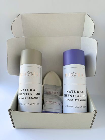 1 natural lavender essential oil shower steamer canister, 1 eucalyptus essential oil shower steamer canister and a steamer dish tray in a gift box